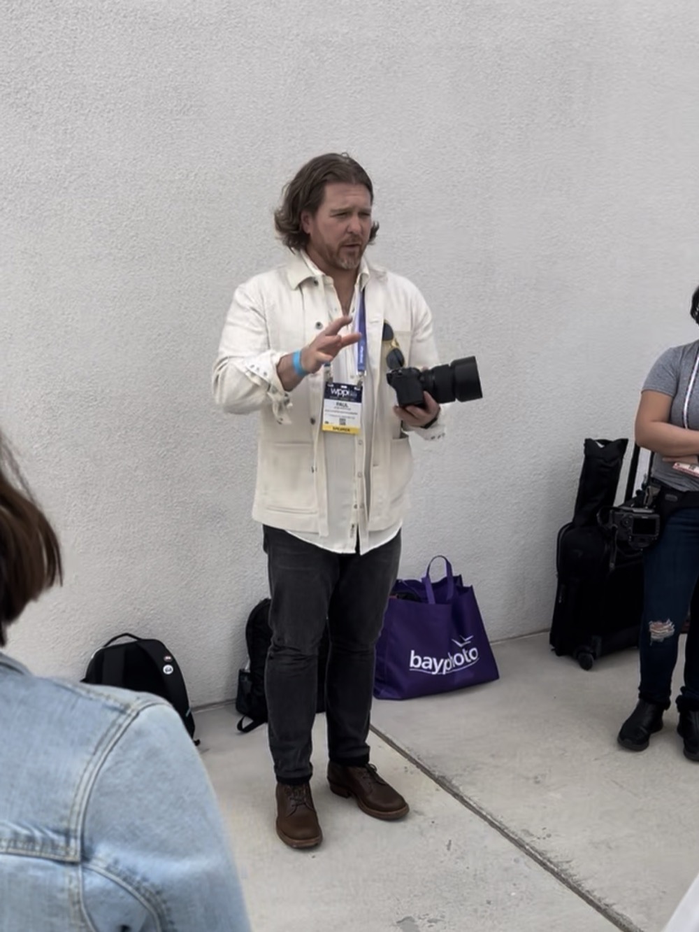 Paul Von Rieter instructing his WPPI walkabout class, speaker badge on